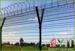 Airport fencing with barbed wire