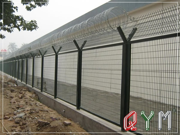 Airport fence with razor barbed